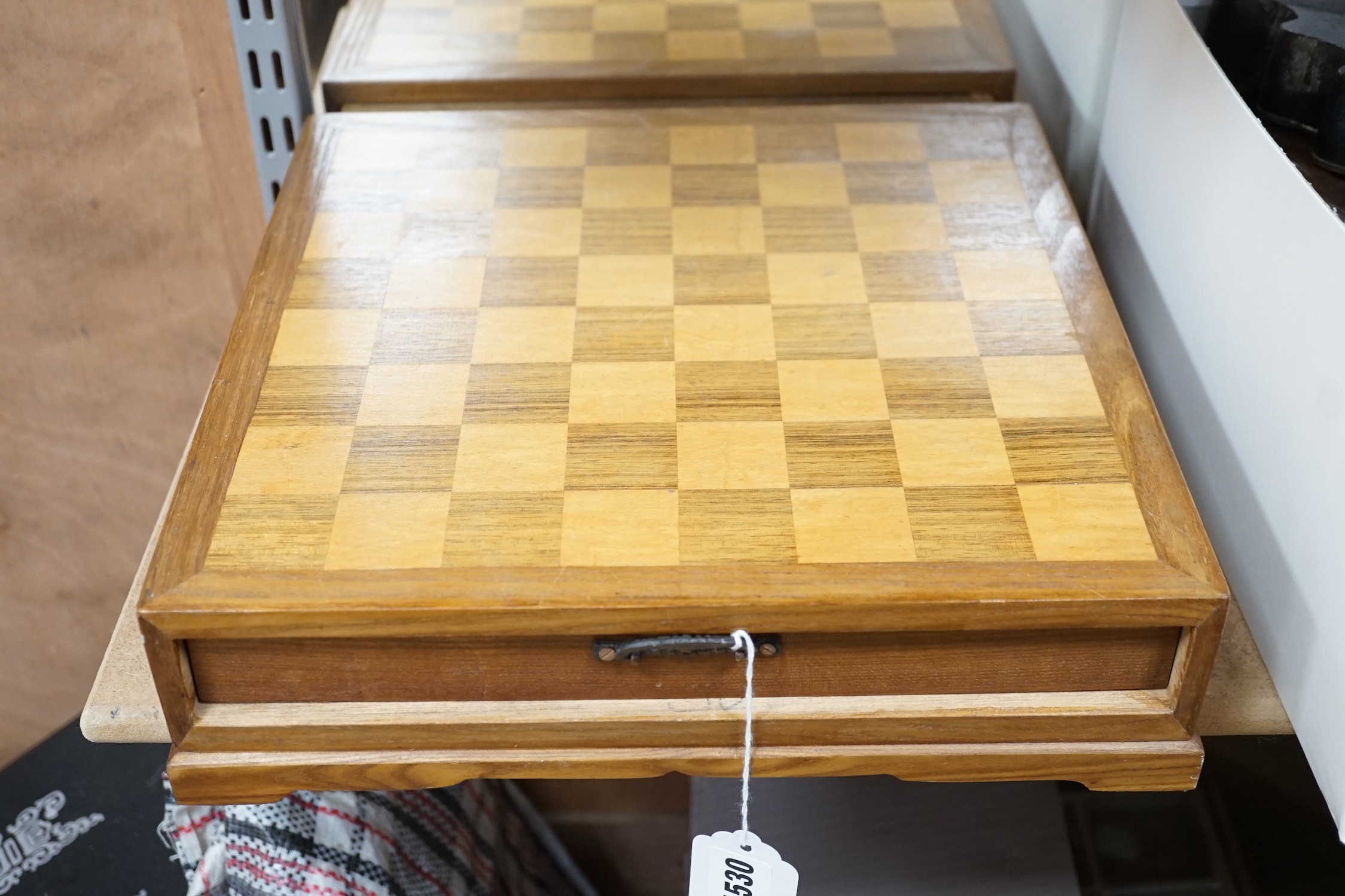 A chess board, with carved soapstone chess pieces